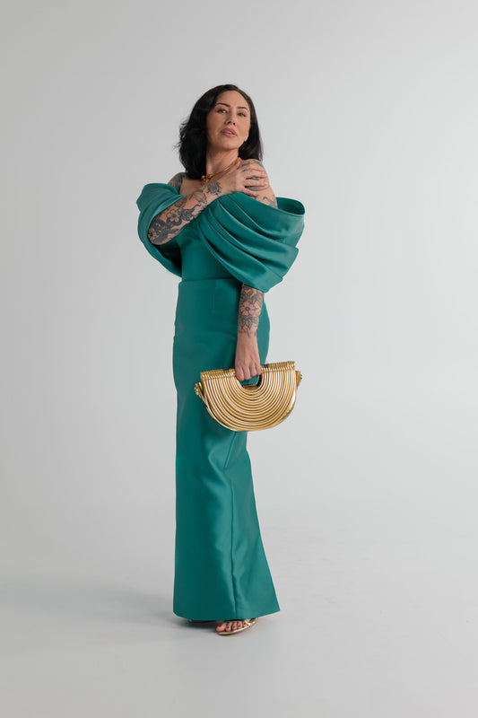 Eliya the Label Vera teal off-the-shoulder dress with sculptural draping, styled with the Verano Hill Amara gold handbag.