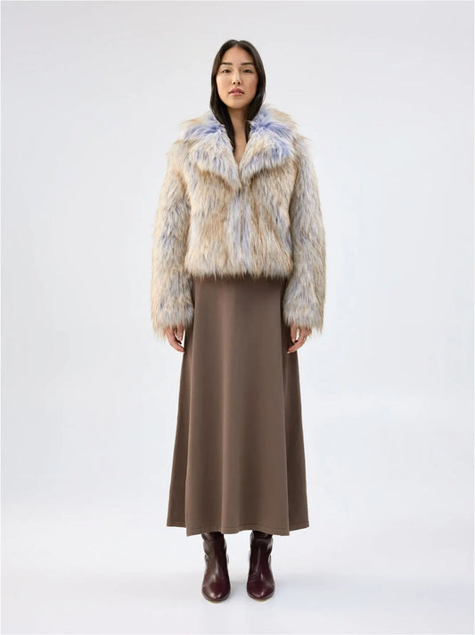 Front view of Unreal Fur Harmony Purple Coyote faux fur jacket showing the plush collar, long sleeves and multitone cream, tan and soft purple faux fur.
