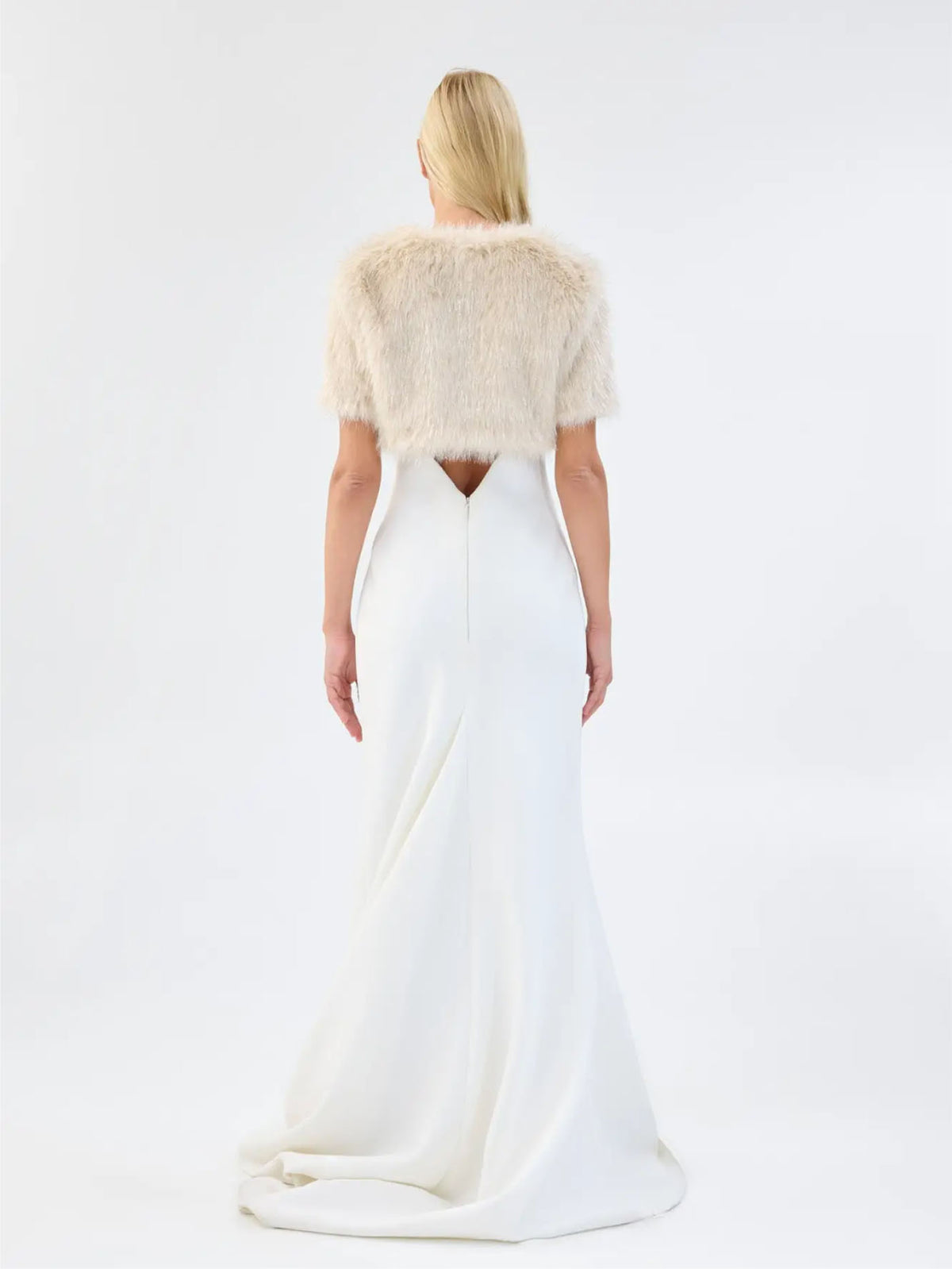 Back view of Unreal Fur Wings Bolero in caramel showing the cropped faux fur silhouette, short sleeves and soft textured finish.