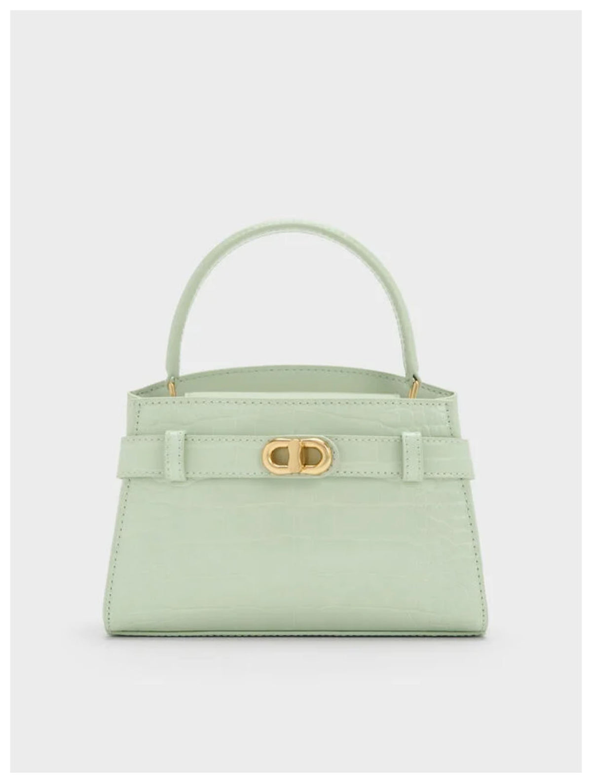 Charles & Keith Aubrielle mint croc-effect belted top handle bag with gold-tone hardware, front view. 