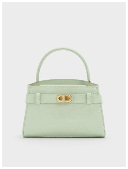 Charles & Keith Aubrielle mint croc-effect belted top handle bag with gold-tone hardware, front view. 