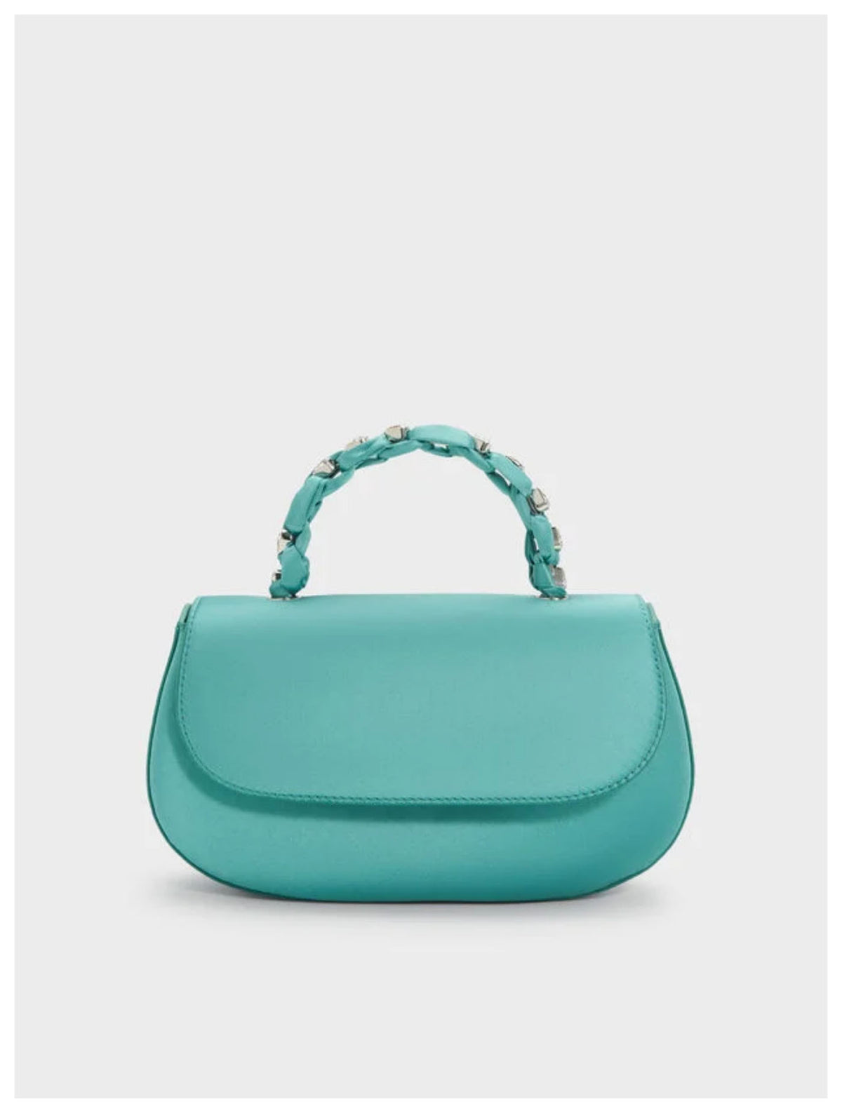 Charles & Keith Augustine silver metallic eel-effect shoulder bag with curved silhouette, front view. 