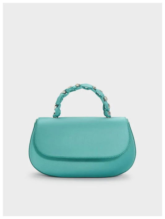 Charles & Keith Augustine silver metallic eel-effect shoulder bag with curved silhouette, front view. 