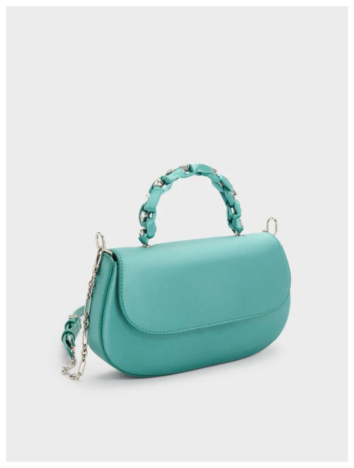Angled side view of Charles & Keith Augustine silver metallic eel-effect shoulder bag with adjustable strap. 