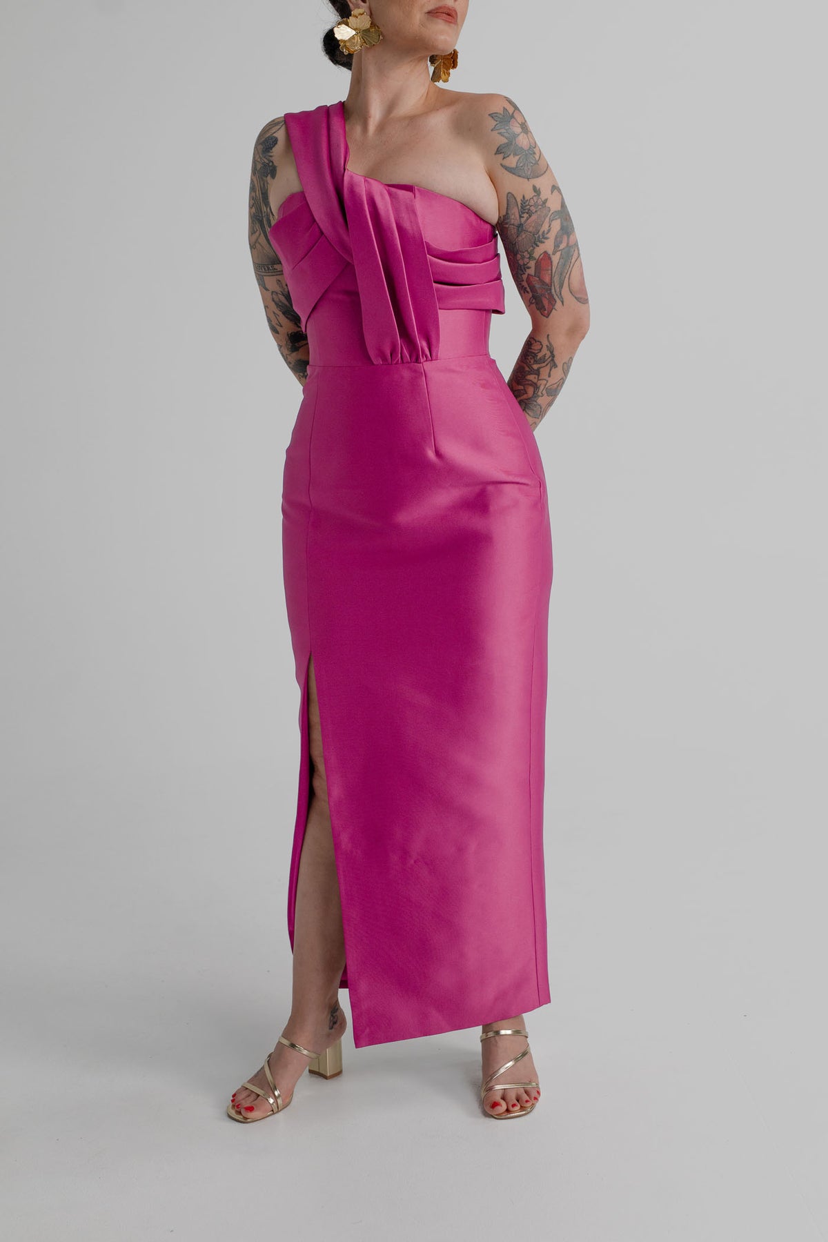 Eliya the Label Renata vivid magenta one-shoulder midi dress with layered folded bodice detailing, fitted column silhouette and side split.
