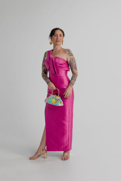Eliya the Label Renata vivid magenta one-shoulder midi dress styled with the Olga Berg Audrey floral sequin top handle bag.
