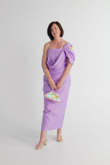 Eliya the Label Scarlett lilac draped midi dress styled with the Olga Berg Audrey floral sequin top handle bag.
