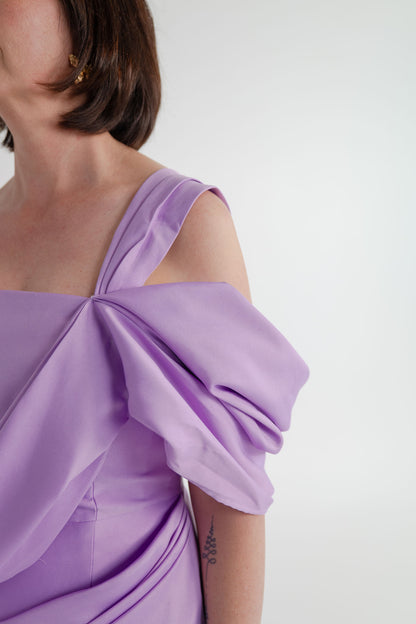 Close-up of the Eliya the Label Scarlett lilac dress showing the sculptural one-shoulder fold and softly draped bodice detailing.
