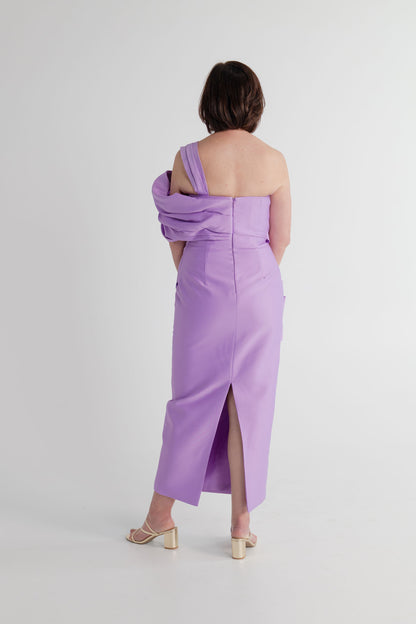 Back view of the Eliya the Label Scarlett lilac one-shoulder midi dress showing the fitted silhouette, asymmetric shoulder detail and centre-back zip.
