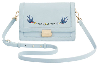 Fable England pale blue Blue Bird embroidered foldover bag with gold-tone clasp and detachable shoulder strap, front view. 
