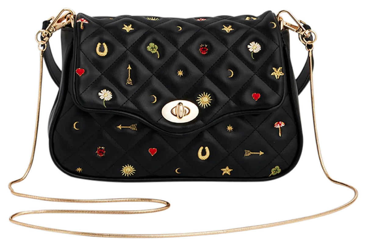 Fable England Mary black quilted crossbody clutch with embroidered motifs and long gold-tone chain strap. 
