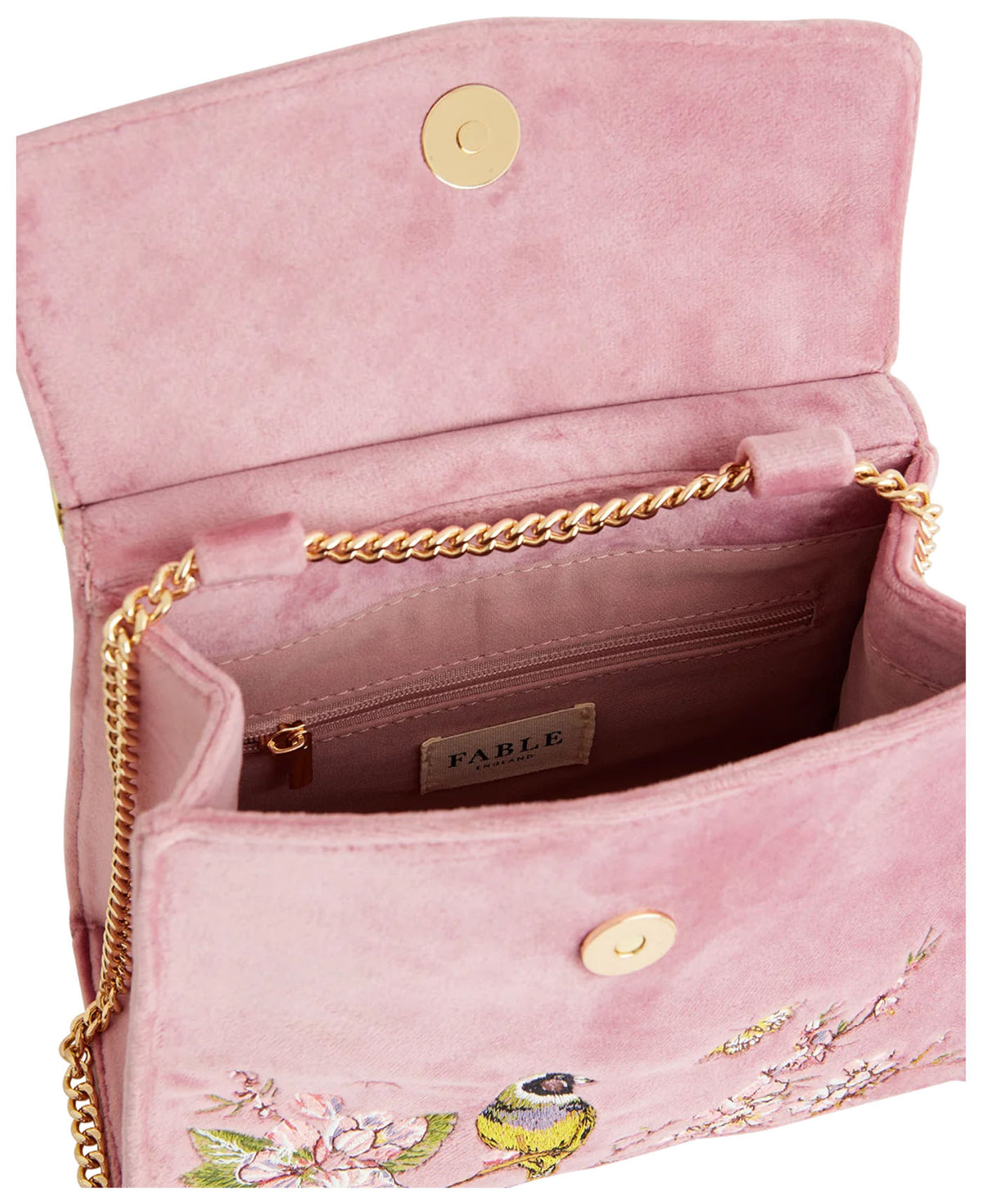 Open view of Fable England Morning Song dusty pink mini tote showing the velvet interior, zip pocket and gold-tone chain. 

