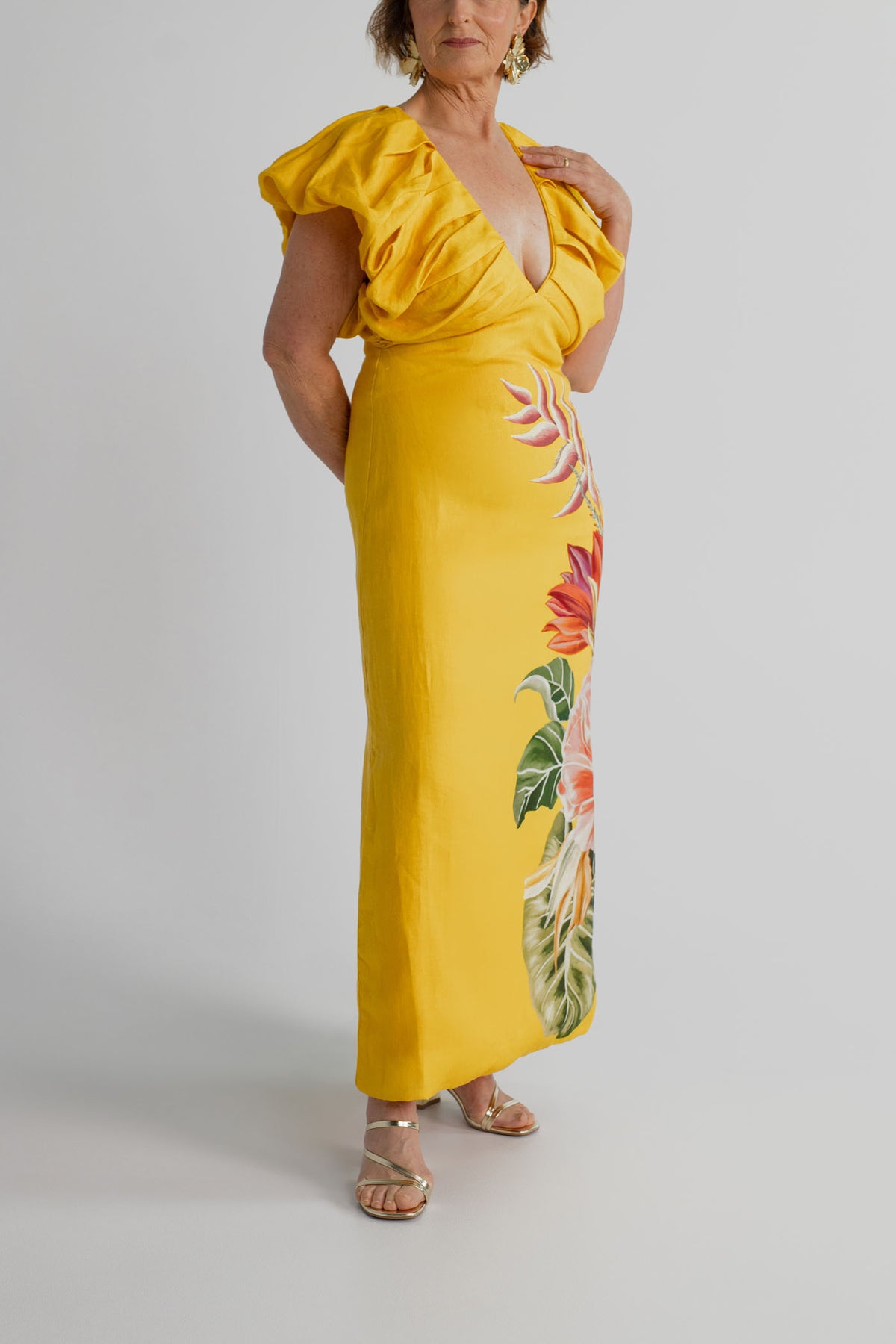 Front detail of the Farm Rio Spring Awakening Midi showing the deep V neckline, gathered ruffle sleeves and tropical floral print.
