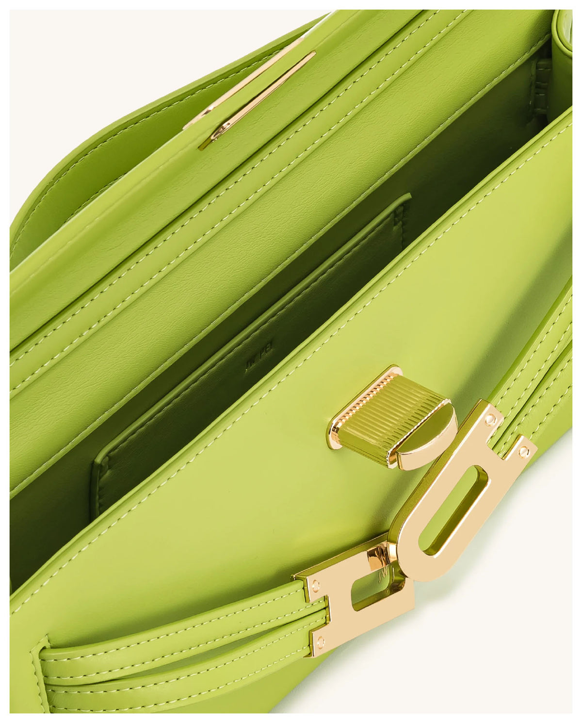 Open view of JW Pei Bria chartreuse structured top handle bag showing the interior compartment and gold-tone closure. 
