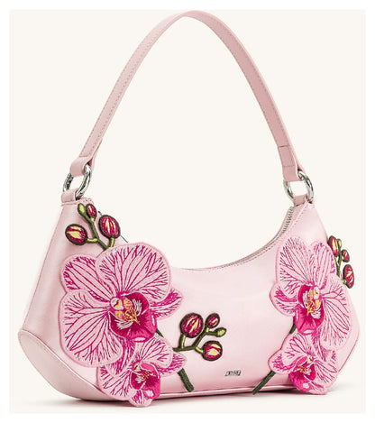 Angled side view of JW Pei Lily pink orchid embroidered shoulder bag showing the curved silhouette and shoulder strap. 
