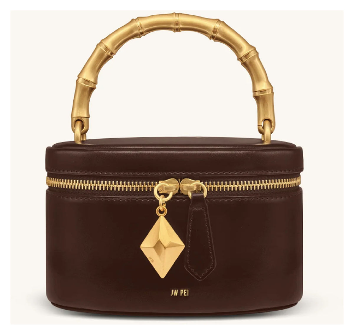 JW Pei Natalie dark brown handle bag with gold-tone bamboo-style top handle, geometric pendant and zip closure, front view. 
