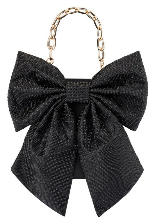 Olga Berg Drew black crystal bow bag with oversized crystal bow and long gold-tone chain strap, front view. 
