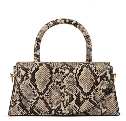 Olga Berg Kendall snake print top handle croc bag with structured silhouette and gold-tone hardware, front view. 
