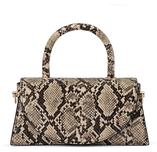 Olga Berg Kendall snake print top handle croc bag with structured silhouette and gold-tone hardware, front view. 
