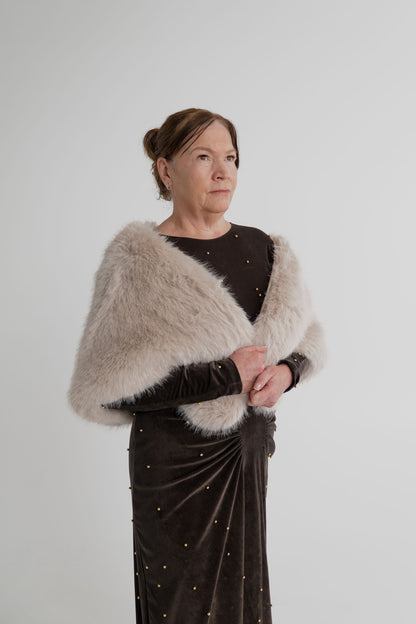 One Fell Swoop Lucent Iron Maiden dark bronze maxi dress styled with the Unreal Fur Yasmine almond faux fur wrap.
