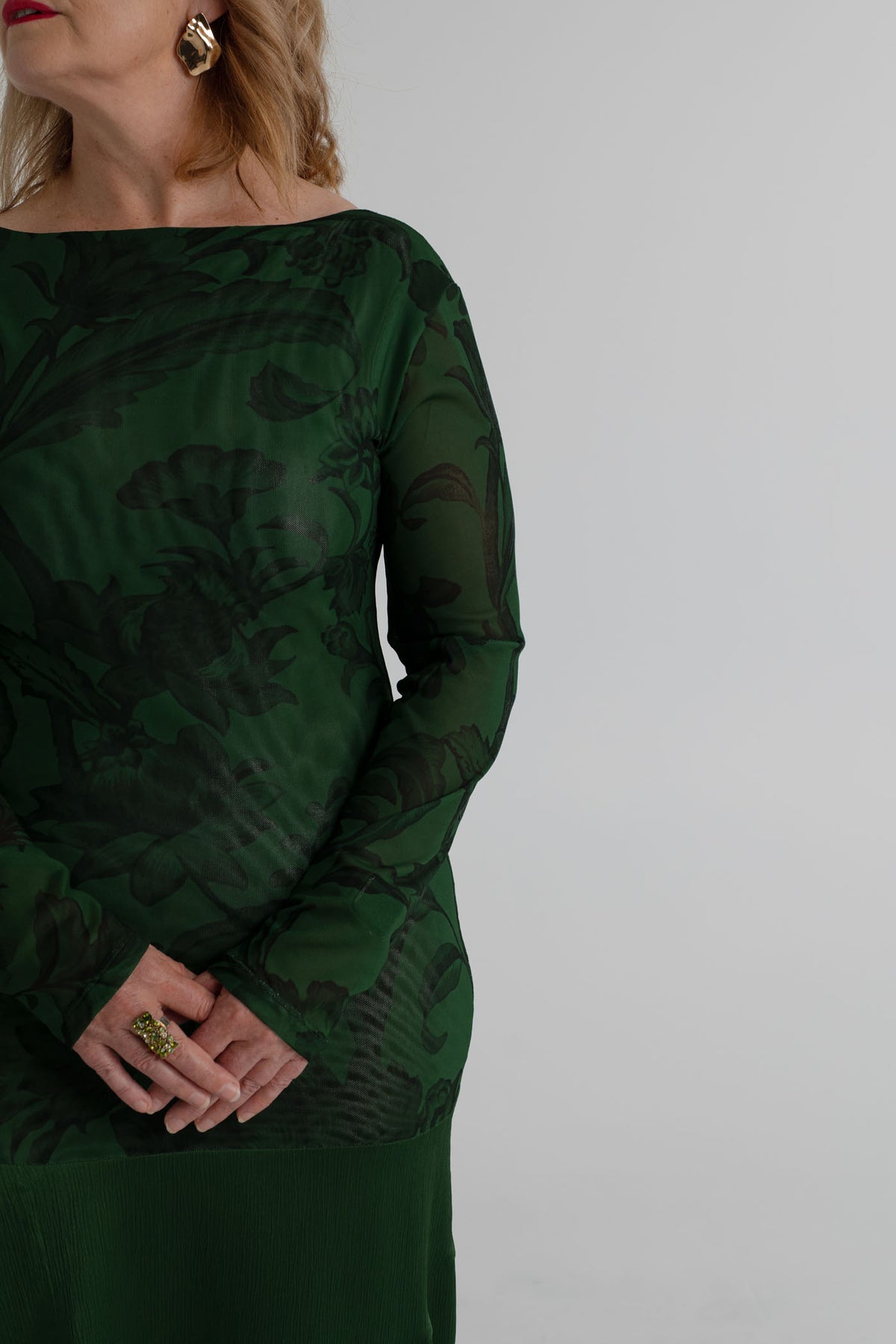One Fell Swoop New Order deep green floral maxi dress with fitted printed mesh bodice, long sleeves and fluid full-length satin skirt.
