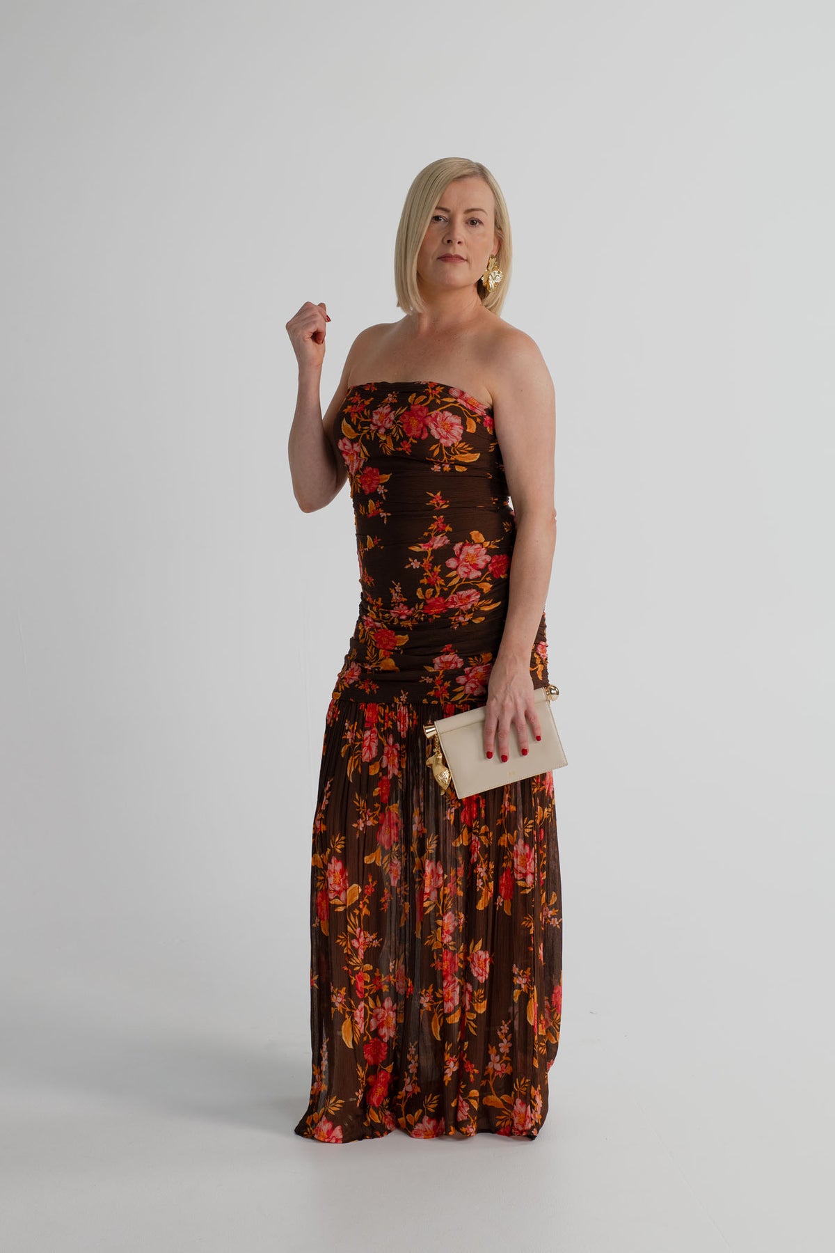Pasduchas Wren chocolate floral strapless maxi dress styled with the JW Pei Holly cream metal pendant embellished clutch.
