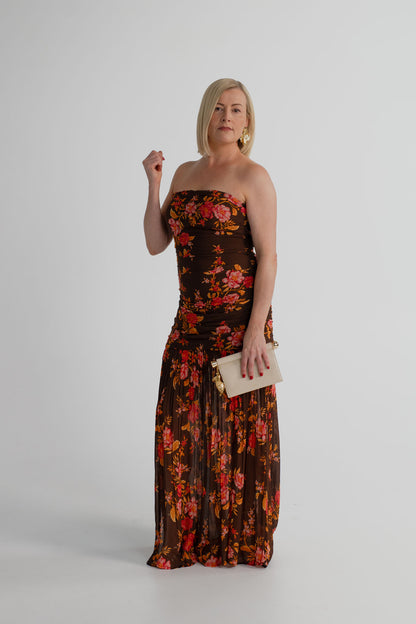 Pasduchas Wren chocolate floral strapless maxi dress styled with the JW Pei Holly cream metal pendant embellished clutch.
