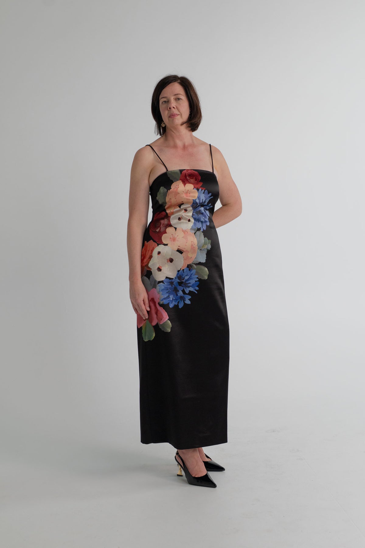 Saba Corsage Midi Dress in black satin with statement floral print, square neckline, fine straps and a streamlined midi silhouette.
