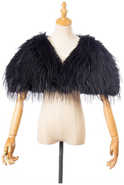 The Two Mrs Grenvilles black faux fur shrug on a mannequin showing the cropped silhouette, open front and long-pile texture. 
