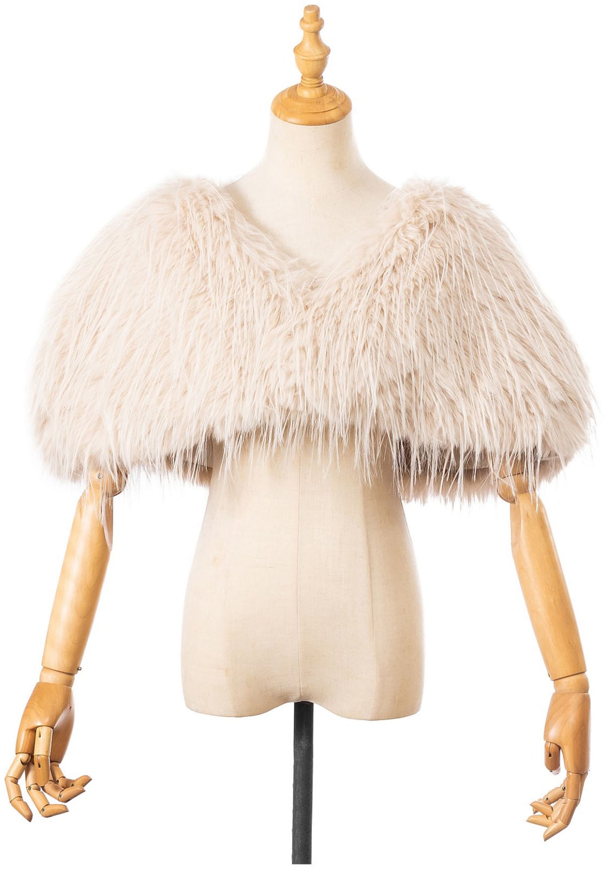 The Two Mrs Grenvilles ivory faux fur shrug on a mannequin showing the cropped silhouette, soft long-pile texture and short cape-style sleeves. 
