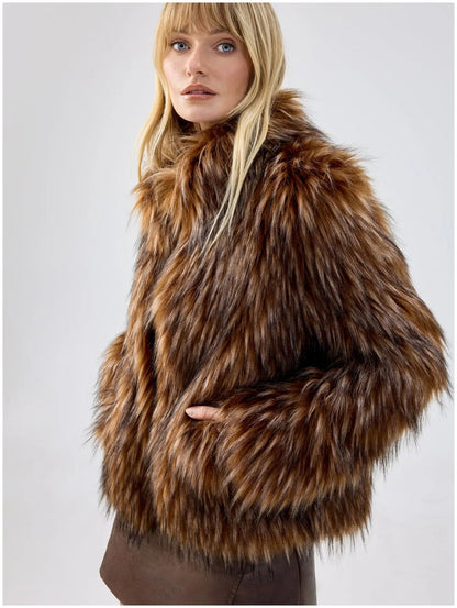 Close-up angled view of Unreal Fur Fur Delish brown faux fur jacket highlighting the rich brown tones, plush texture and high neckline. 

