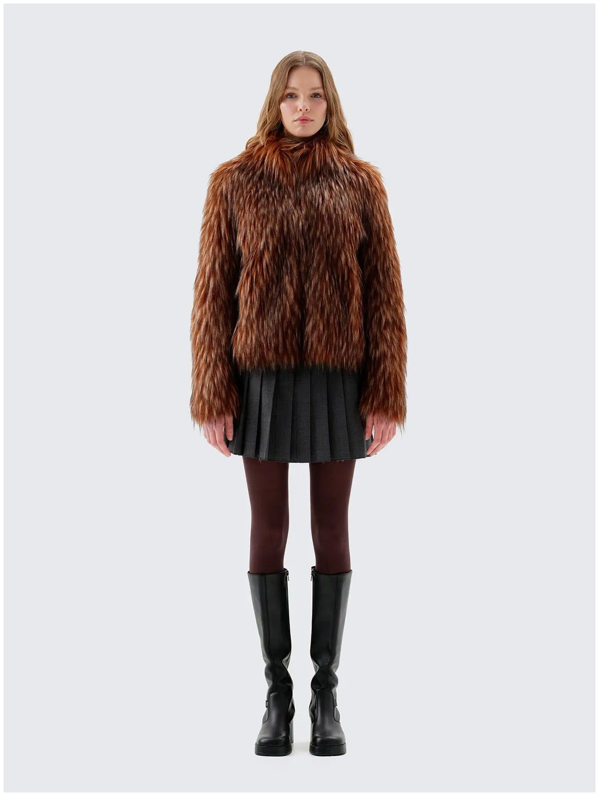 Front view of Unreal Fur Fur Delish brown faux fur jacket showing the high neckline, long sleeves and hip-length silhouette. 
