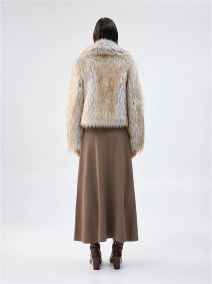 Back view of Unreal Fur Harmony Purple Coyote faux fur jacket showing the hip-length silhouette, long sleeves and multitone faux fur finish. 
