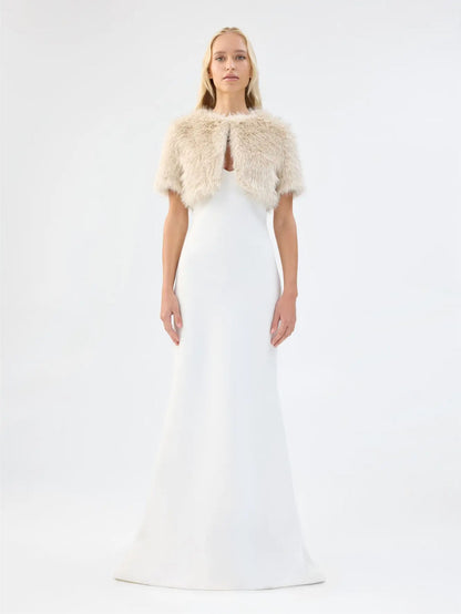Front view of Unreal Fur Wings Bolero in caramel showing the cropped open-front silhouette, short sleeves and plush faux fur texture. 
