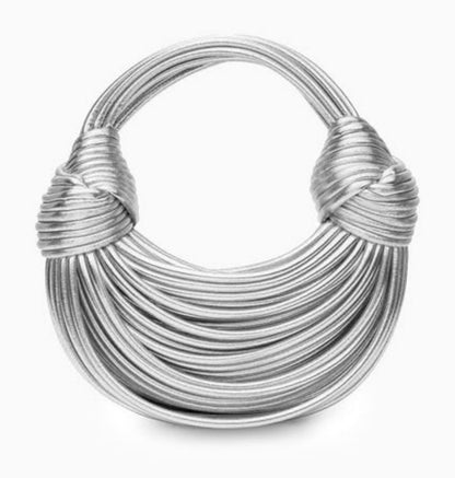 Verano Hill Amanda silver bag with sculptural ribbed loop design and knotted handle detailing, front view. 
