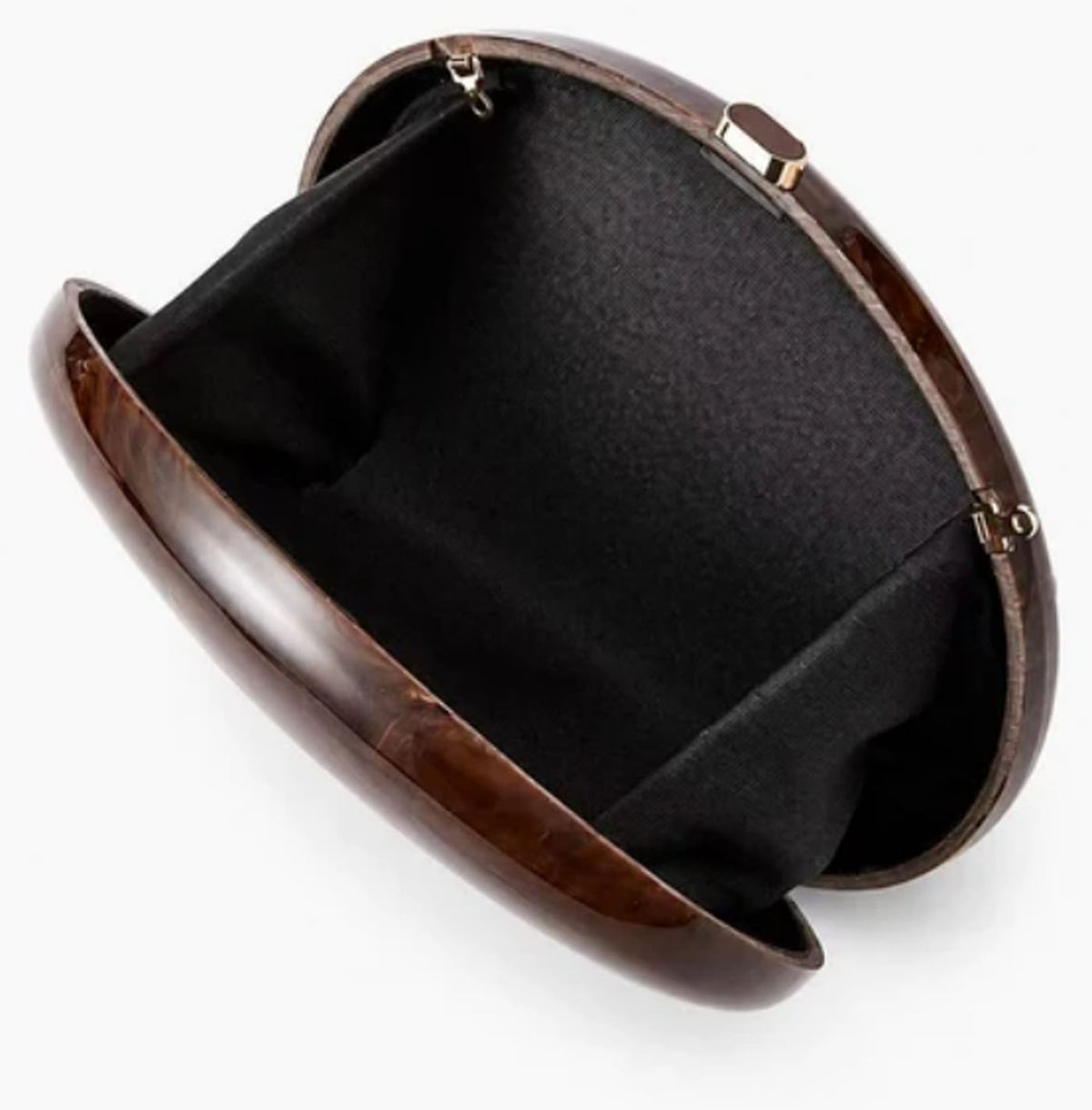 Open view of Verano Hill Amber brown marbled clutch showing the black fabric interior. 
